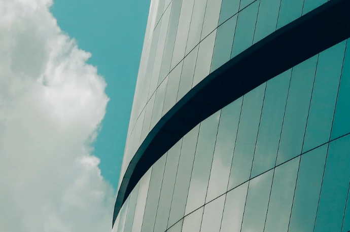 low angle photo of curtain glass wall building
